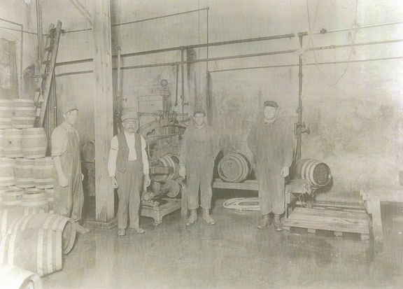Stevens Point Brewery workers pose for a photo in the keg racking wash-house   Ca  1920